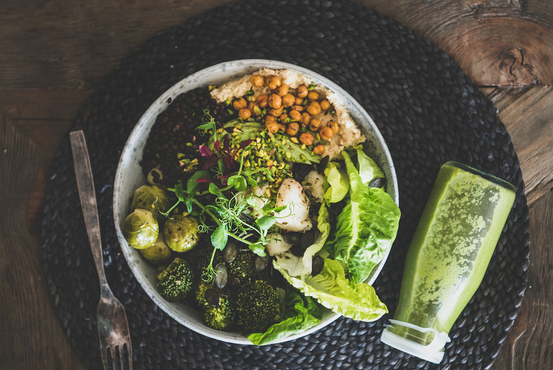 Flat-lay of healthy dinner vegetarian superbowl and smoothie