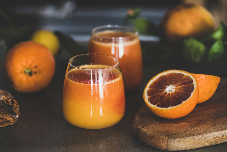 Glasses of freshly squeezed blood orange juice or smoothie, close-up