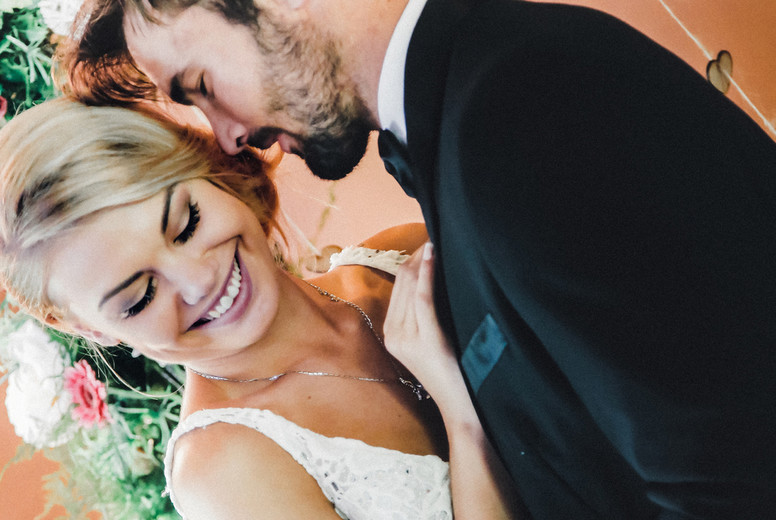 Bride laughing at groom