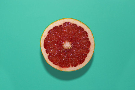 grapefruit on a turquoise backgr