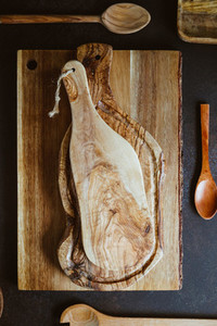 Top view of rustic wooden kitchenware  Cutting boards and spoons  Eco and natural cooking concept