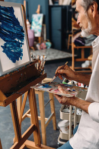 Senior artist working in studio