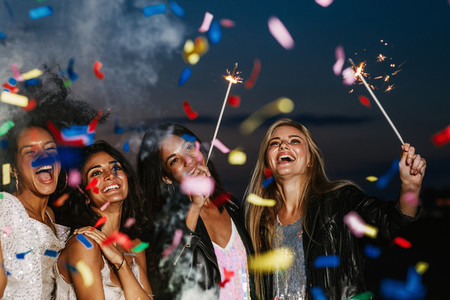 Four happy girls celebrating