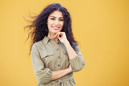 Young Arab Woman with curly hair outdoors