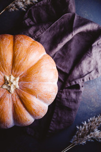 High angle view of a big pumpkin on a table  Halloween of Thanksgiving concept