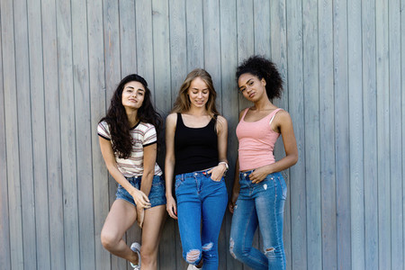 Three female friends standing