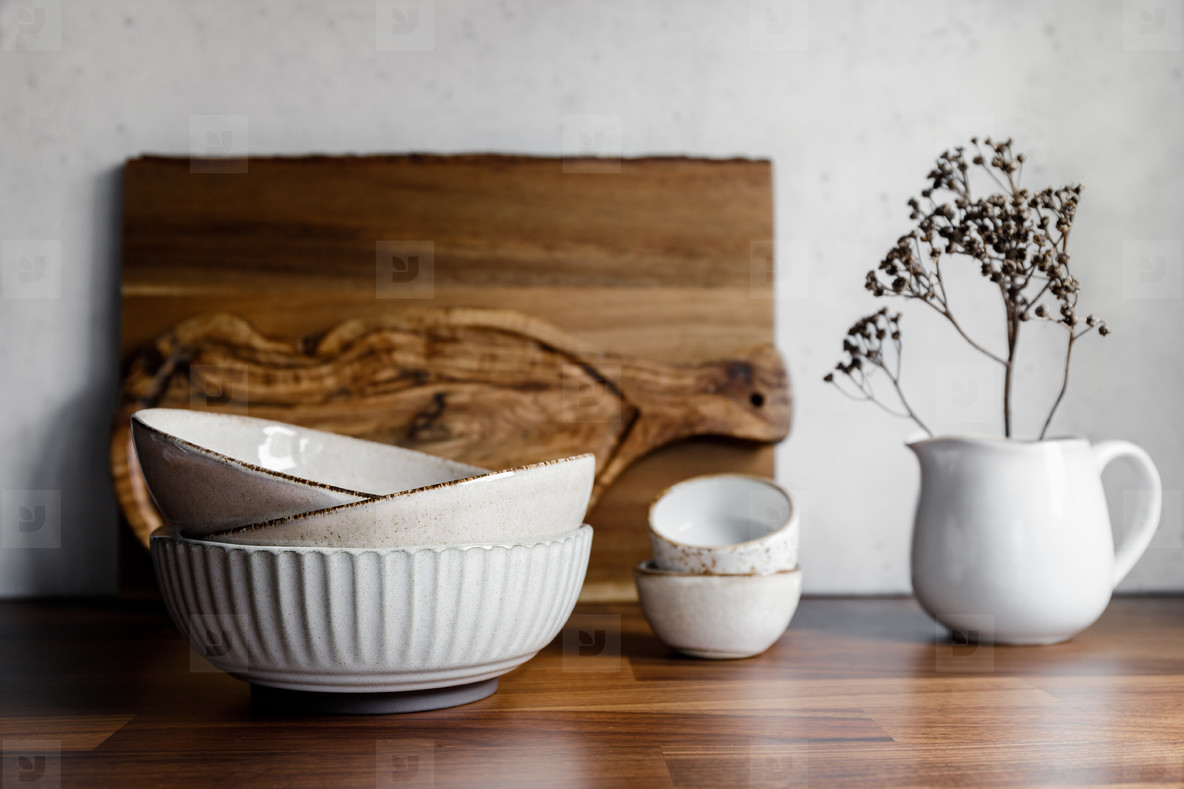 Set of kitchen ceramic tableware and wooden cutting boards on a table. Eco  style home still life stock photo (201977) - YouWorkForThem