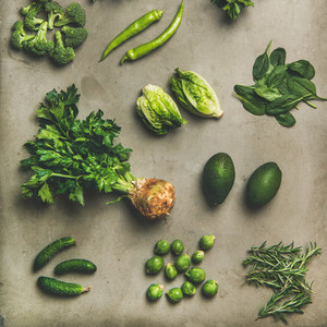 Healthy vegan ingredients layout over concrete table background square crop