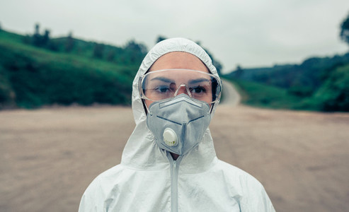 Woman with bacteriological protection suit