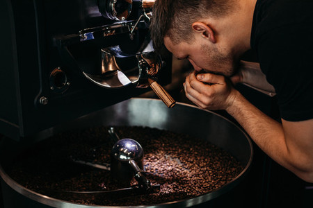 Man smelling coffee beans