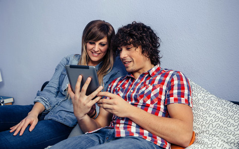 Couple looking at the tablet