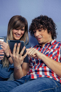 Couple making online purchase with tablet