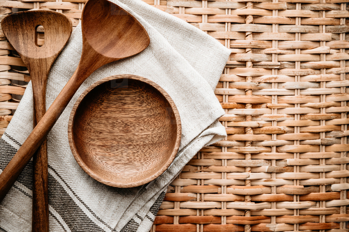 Cooking eco style background  Wooden kitchen tools and bowl on a rattan
