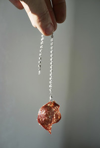 Hand dangling bracelet with pepperoni