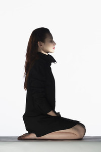 Portrait serene woman in black dress