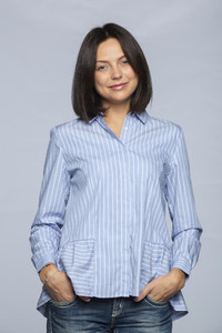 Portrait confident woman in blue and white striped blouse