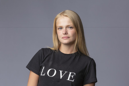 Portrait confident young blonde woman in love t shirt