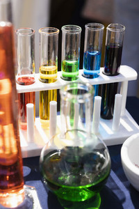 Multicolor liquid in test tube rack and beaker