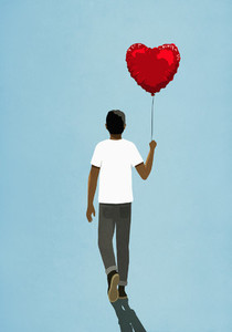 Man walking with heart shape balloon