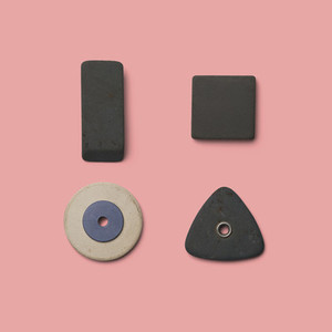 Rubber pieces in various shapes on pink background