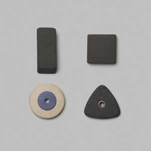 Rubber pieces in various shapes on gray background