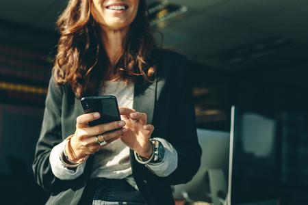 Businesswoman with a on mobile phone in office
