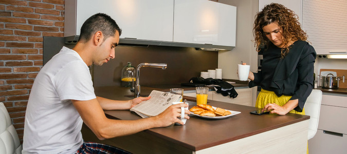 Couple having fast breakfast before go to work
