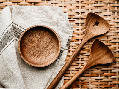 Cooking eco style background  Wooden kitchen tools and bowl on a rattan