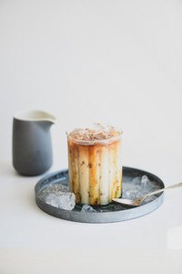 Ice caramel macchiato coffee with vanilla syrup and ice