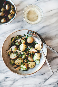 Greek lunch with potato salad  olives and white wine