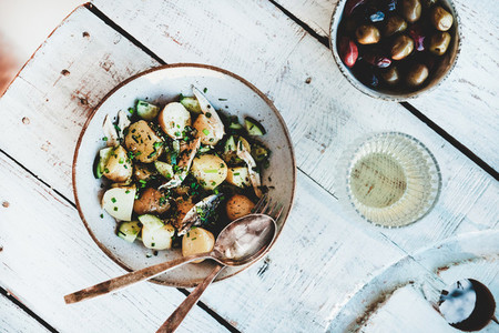 Healthy summer lunch with potato salad  olives and white wine