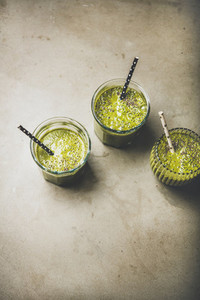 Vegan green smoothies in glasses with chia seeds  top view