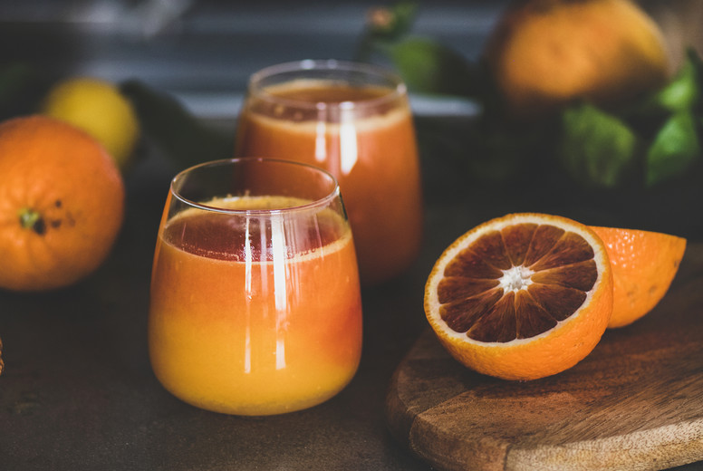 Glasses of fresh blood orange juice or smoothie, square crop