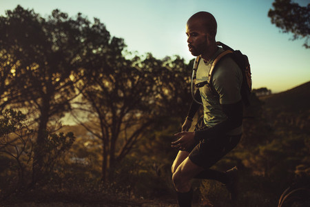 Trail runner practicing on mountain path