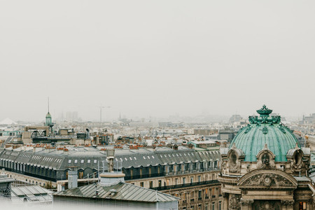 Aerial view of cloudy Paris with grey sky
