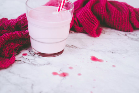 Delicious strawberry milkshake composition in pink and white