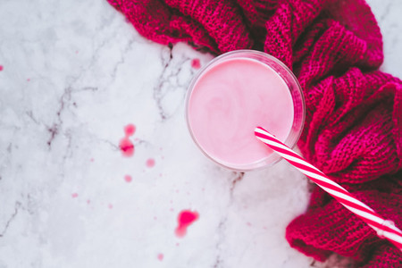 Delicious strawberry milkshake composition in pink and white
