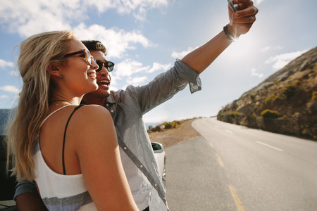 Couple on road trip taking a selfie
