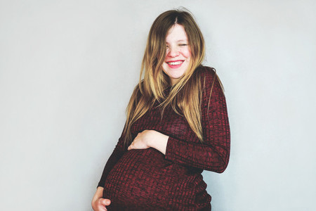 Really happy young pregnant woman