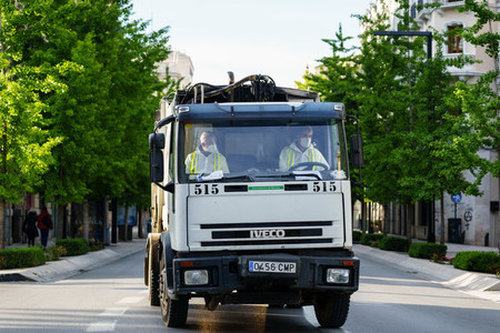 GRANADA  SPAIN  23RD APRIL  2020 Garbage truck driving on the empty street