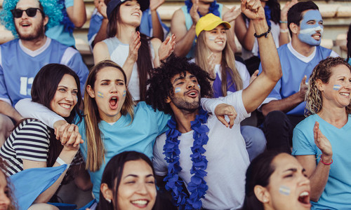 Argentinian spectators in stadium cheering their team