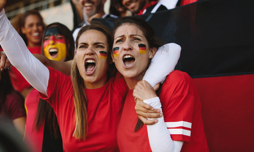 Females from Germany cheering from fan zone