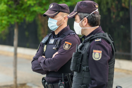 Spanish police with protective masks due to Coronavirus