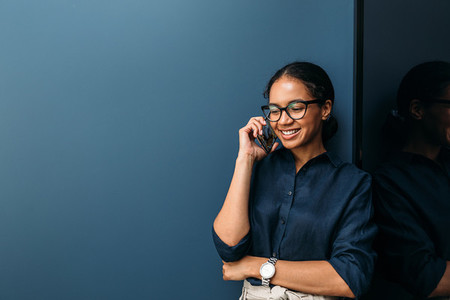 Smiling woman making phone call