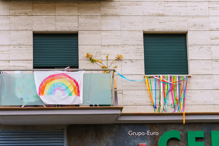 Rainbow drawing in the facade symbol of hope during Covid 19 outbreak