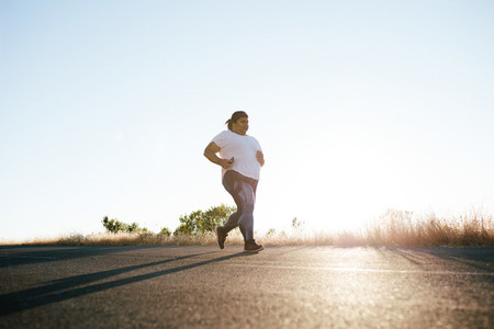 Plus size woman running in morning