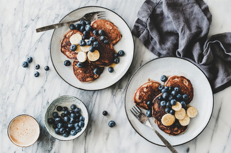 Breakfast banana pancakes with blueberry  honey and coffee