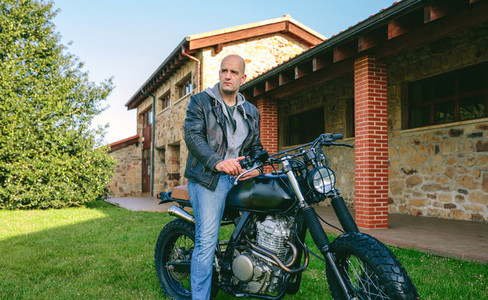 Man riding custom motorbike