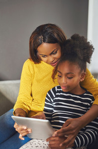 Afro american woman and child with tablet