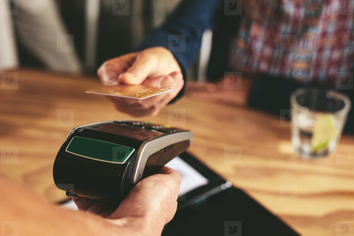 Customer paying bill using nfc card